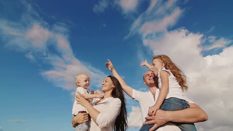 happy family under a beautiful sky