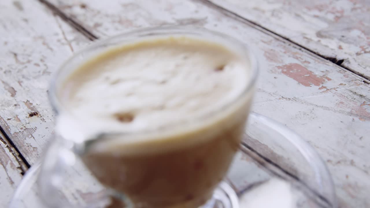 Overlay cue spawning speech bubbles popping and clustering over glass cup with crema, showing chat