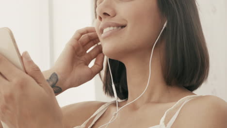 woman enjoying music on her phone