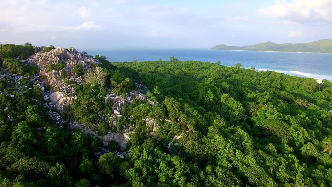 Slow drone flight over secluded tropical island paradise