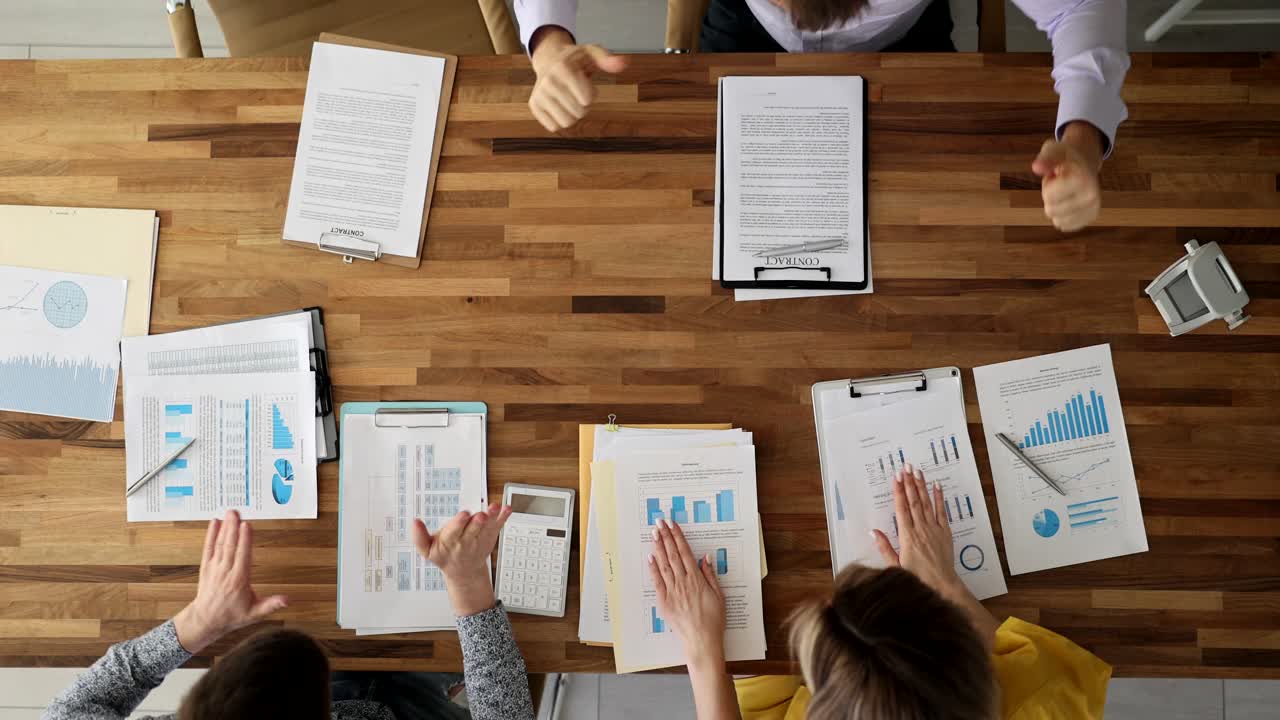 Business meeting with documents and graphs