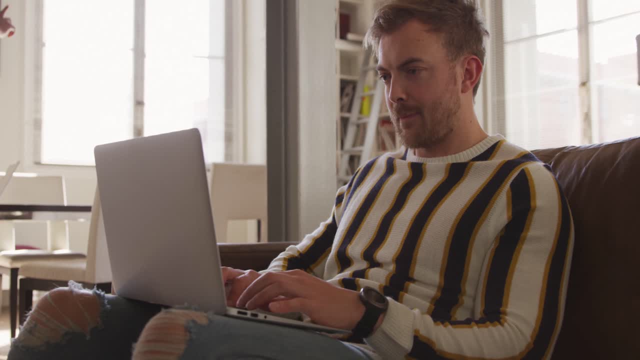 Caucasian male in social distancing working at home