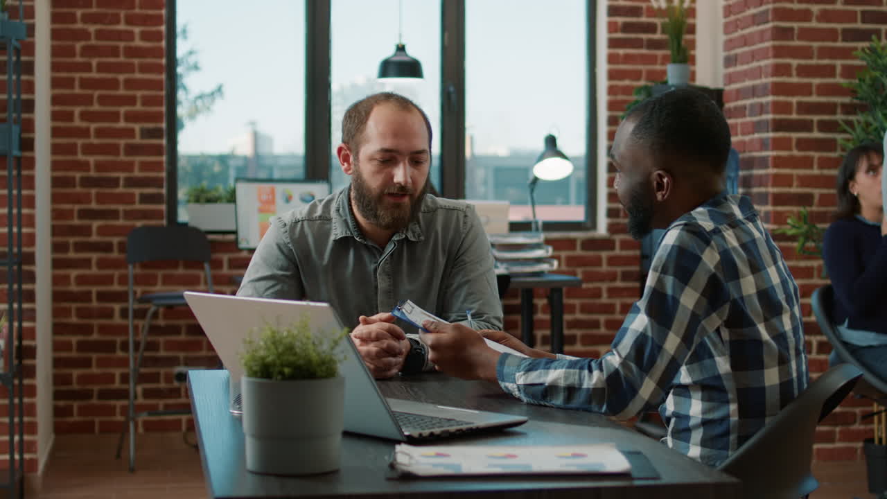 African american recruiter greeting applicant at job interview