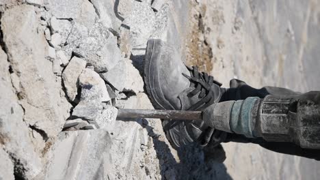 demolishing concrete with a jackhammer