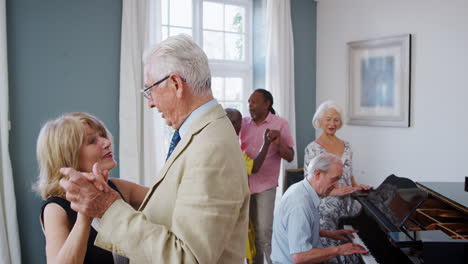 Group-Of-Seniors-Enjoying-Dancing-Club-Together