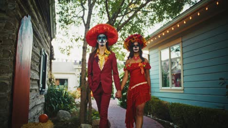 couple in day of the dead costumes