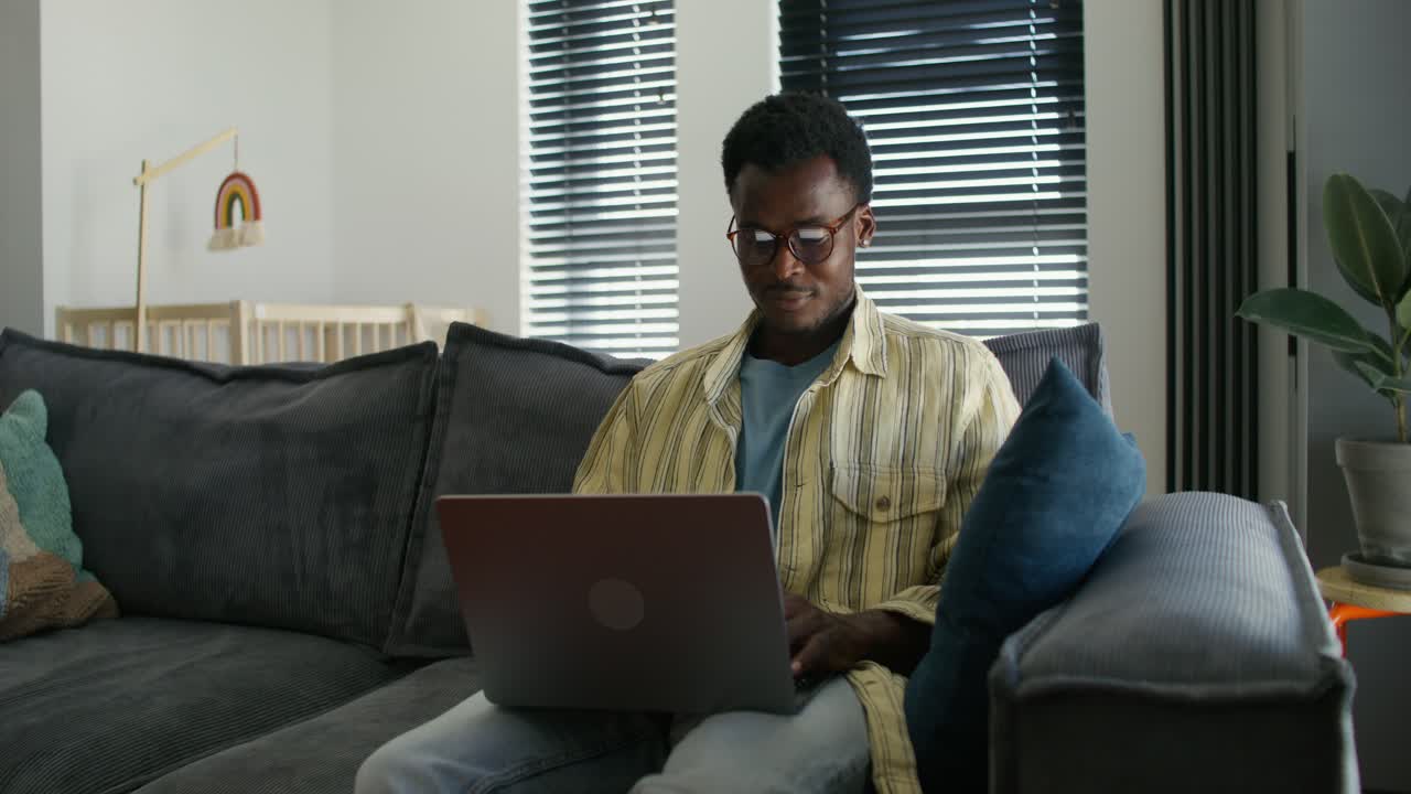 Man Working from Home on Laptop