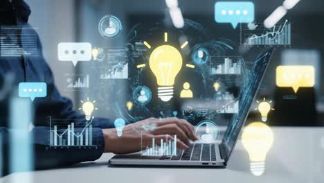 professional working on a laptop with a futuristic holographic user interface dashboard