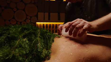 ice therapy back massage in sauna