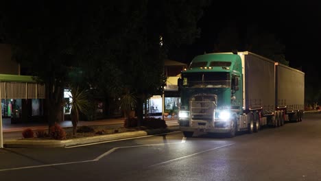 truck turning at an intersection during night