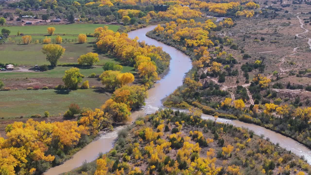 Aerial view of Rio Chama winding through vibrant fall cottonwood trees