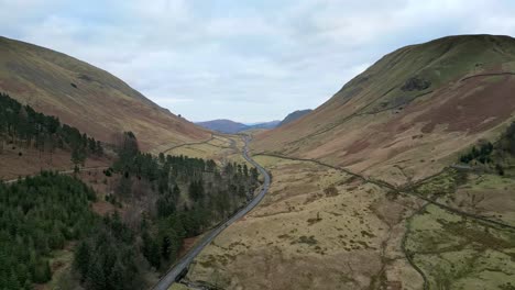 Aerial-footage-of-Lakeland-fells-with-narrow-country-road