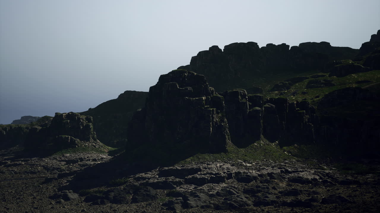 Dramatic rocky landscape under clear sky at dawn with soft lighting effects