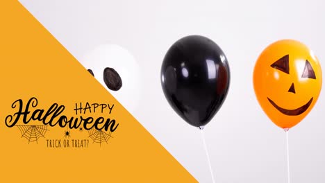 Animation-of-happy-halloween-text-over-balloons