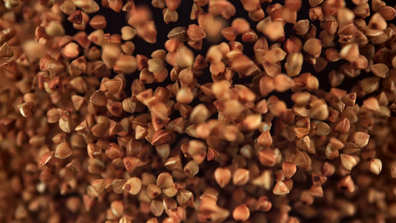 Close-up of Buckwheat Grains Falling in Slow Motion