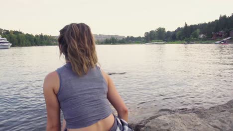 cute hipster girl enjoying the view of the water