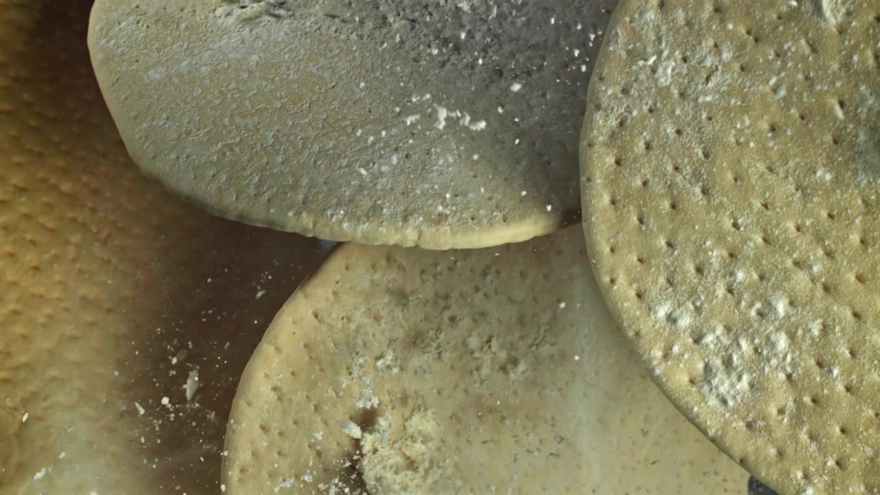 Close-Up of Raw Pizza Dough Bases with Flour