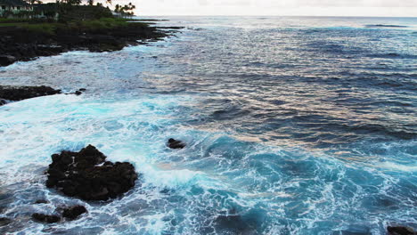 Slow-motion-shot-of-waves-crashing-on-rocky-beach---Aerial-view-of-Pacific-Ocean