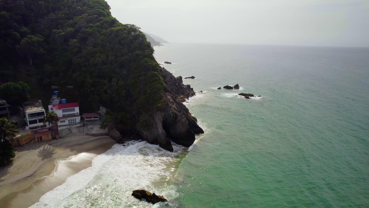 Stunning aerial view of the coastal mountains of La Guaira, near Playa Osma at sunset