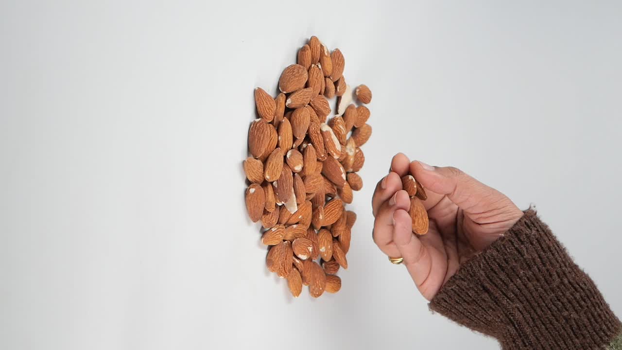 Almonds with hand