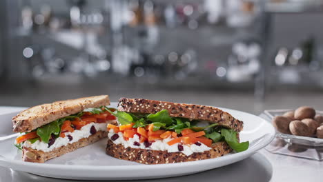 cheff adding nutmeg to the top of a sandwich