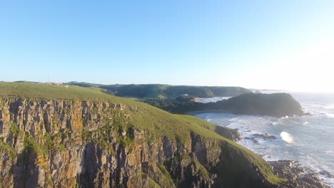 Aerial-action-cinematic-flying-over-surfers-surfing-at-Coffee-Bay-in-South-Africa