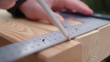 measuring up the wood with a triangle ruler