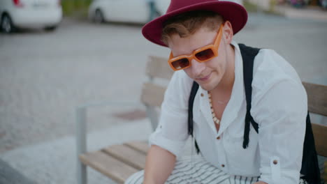 stylish man sitting on a bench