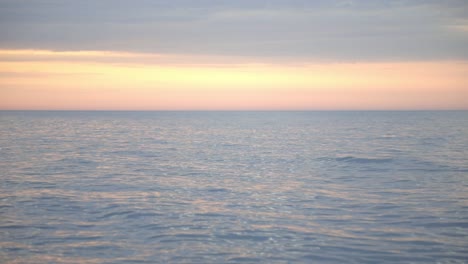 Tranquil-And-Inviting-Scenery-Of-The-Ocean-During-Sunset---wide-shot