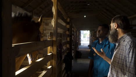 people talking at the stables