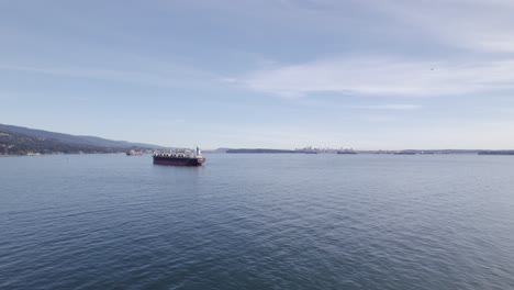 Cargo-ship-docking-in-Vancouver-port,-Canada