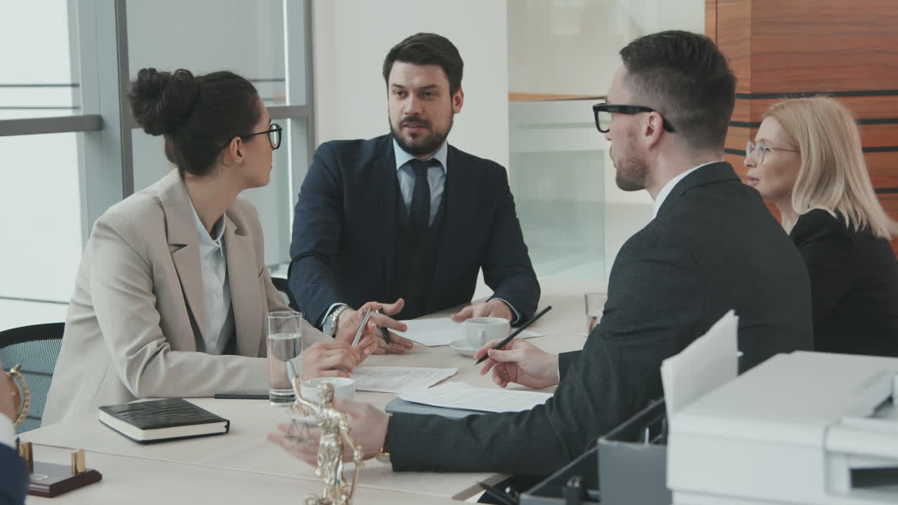 Attorneys Having Heated Discussion at Meeting Table