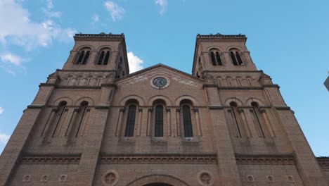 Majestic-towers-of-Catedral-Metropolitana-rising-into-the-Medellin-sky,-Colombia