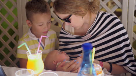 Family-of-mother-with-two-children-enjoying-time-together