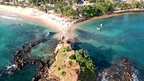 aerial drone of mirissa beach at sunset golden hour