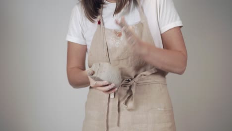 woman sculpting with clay