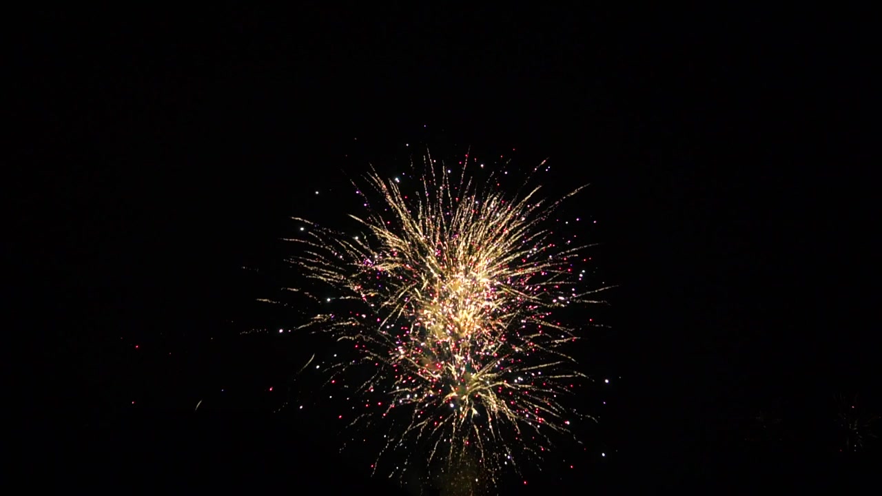 Swirling, cracking bursts of explosive charging fireworks in New Year's Eve in Rotterdam, the Netherlands