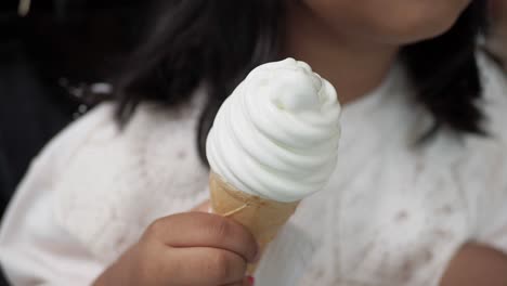 child enjoying a scoop of ice cream