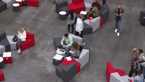 Overhead-shot-of-students-in-a-busy-university-lobby,-shot-on-R3D