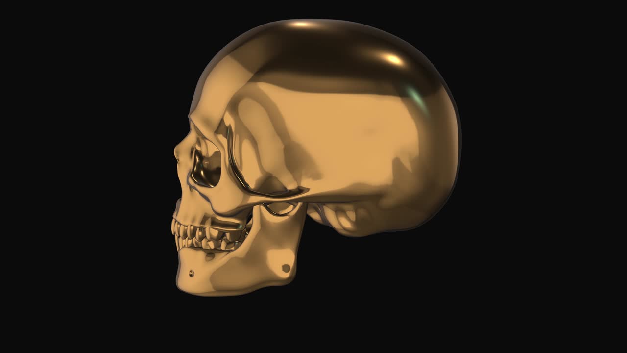 золотой реалистичный череп. круговое вращение на черном фоне.