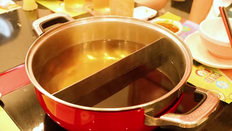 lid removed from pot, broth ready for cooking