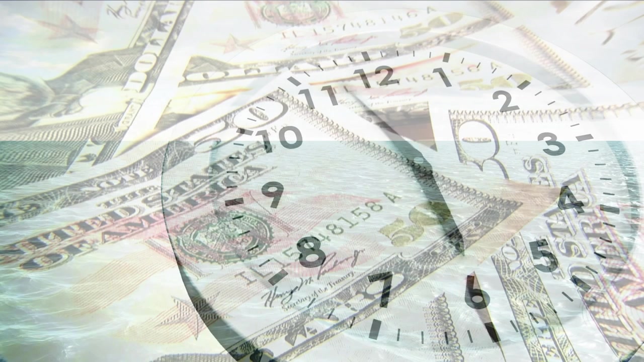 Clock Face Superimposed Over US Dollar Bills