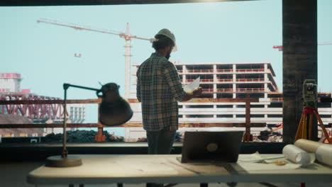 construction engineer overlooking building site