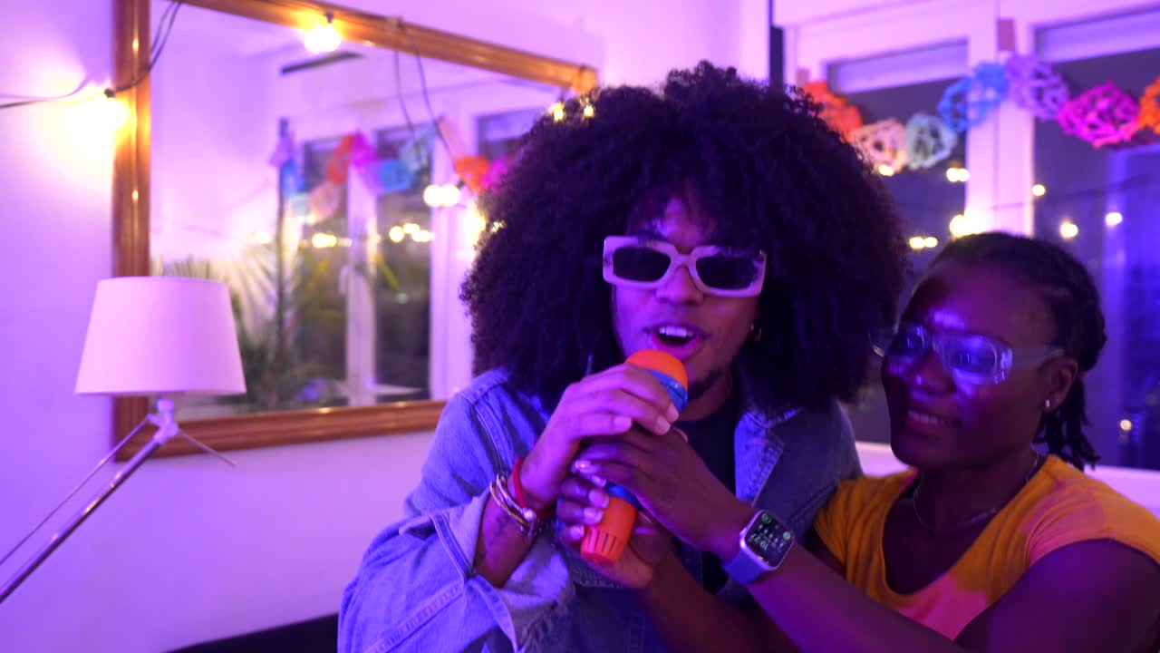 Friends Enjoy Karaoke at Party