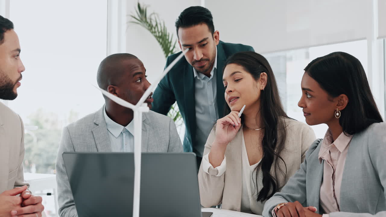 Wind turbine, computer and man in office team