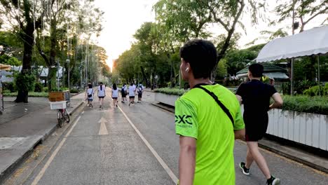 people running and walking in an urban park