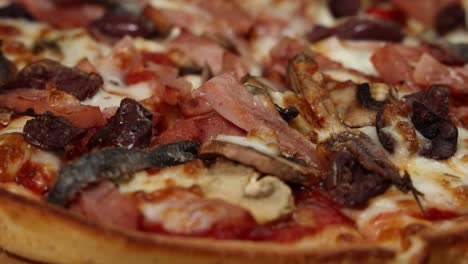 close-up shots of a meat-topped pizza slice.