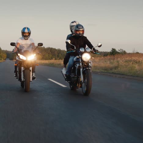 a group of bikers rides along the highway in a row 1