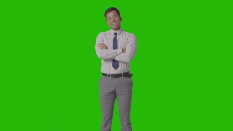 Portrait-Of-Businessman-In-Shirt-And-Tie-Against-Green-Screen-Smiling-At-Camera-4