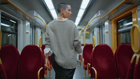 woman walking on subway train